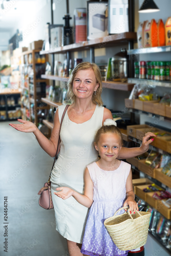 woman with daughter standing