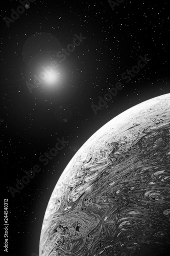 Fototapeta Naklejka Na Ścianę i Meble -  Black and white soap bubble planet with stars and lens flare