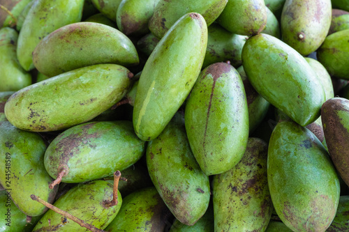 Fresh green mango pile thai cultivars in market at Mae Hong Son, Thailand