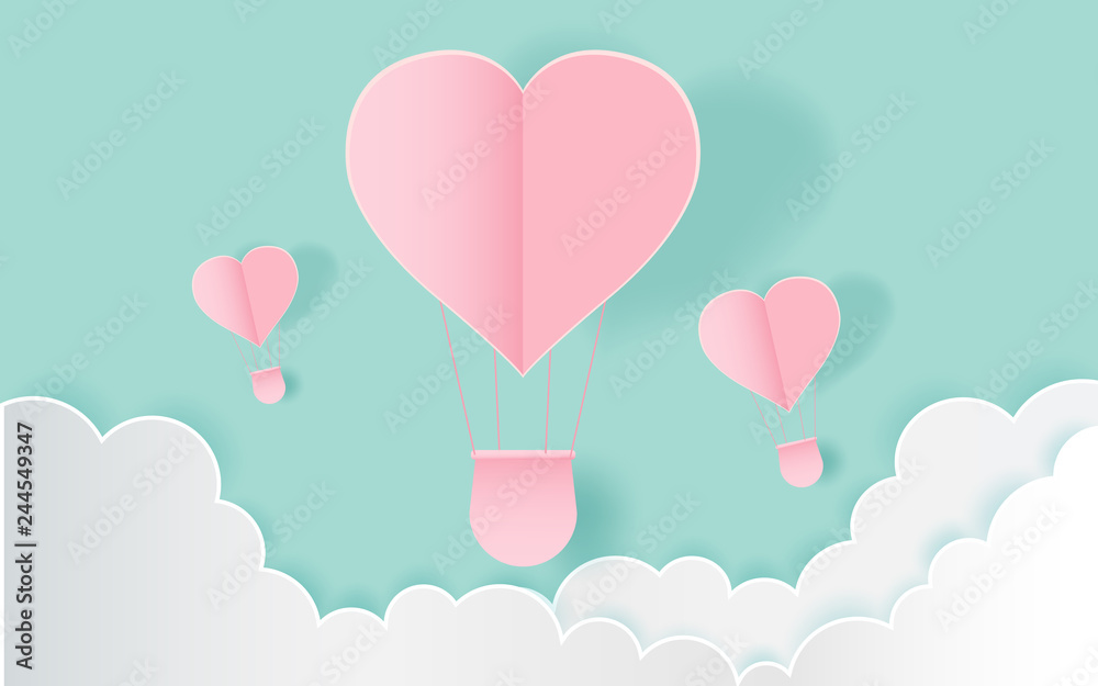  love and valentine day,Origami made hot air balloon flying on the sky with heart float on the sky.paper art 