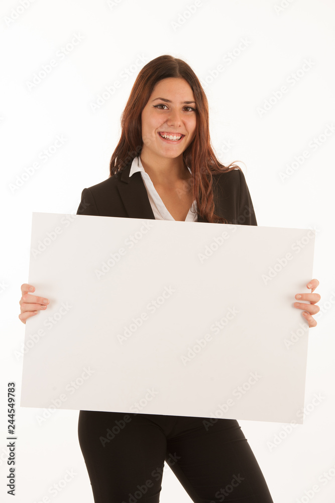 Beautiful business woman holds blank banner isolated over white background Beautiful business woman holds blank banner isolated over white background
