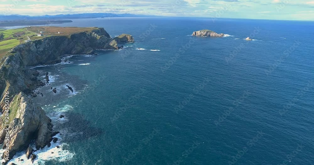 Lateral movement in an general aerial view near sea moving to the coastline with a lot of cliffs in a great heigth Lateral movement in an general aerial view near sea moving to the coastline with a lot of cliffs in a great heigth