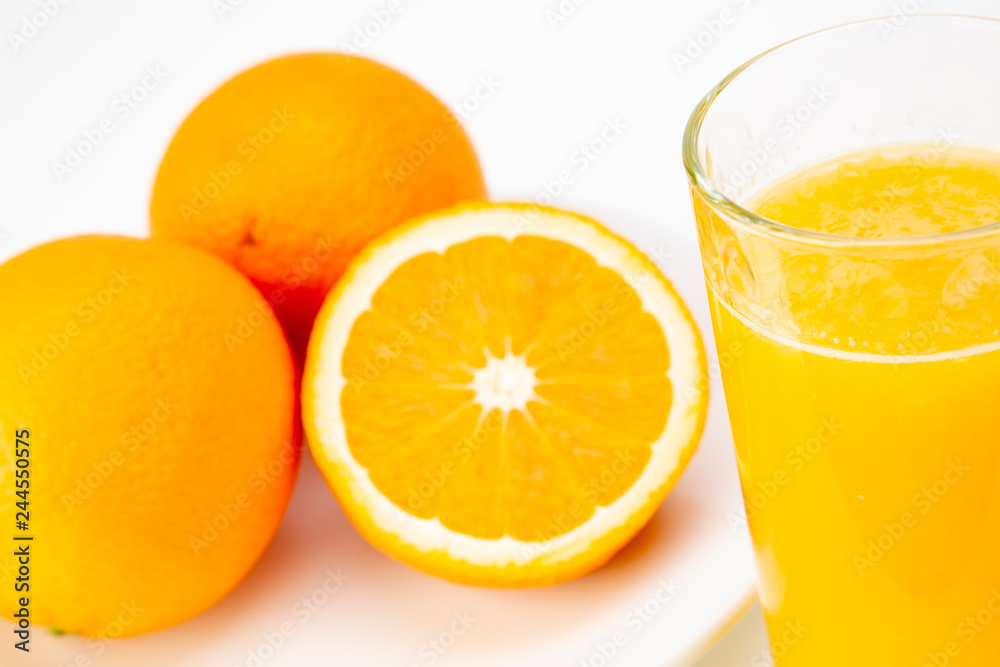 fresh orange juice and half orange isolated on white background fresh orange juice and half orange isolated on white background