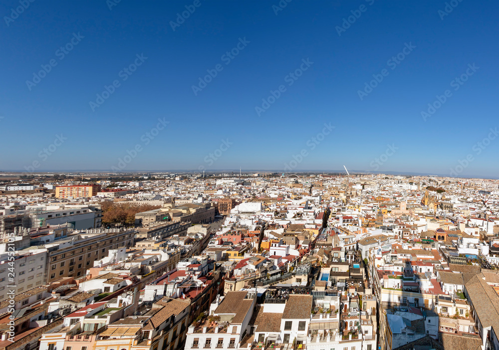 Aerial view of Seville city and Cathedral of Saint Mary of the See in Seville as see from seen from the Giralda tower. Seville, Andalusia, Spain, Europe
