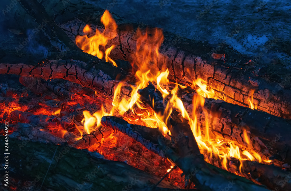 Burning embers in the dark close-up view Burning embers in the dark close-up view