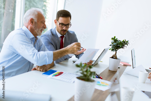 Senior and young  businessm...