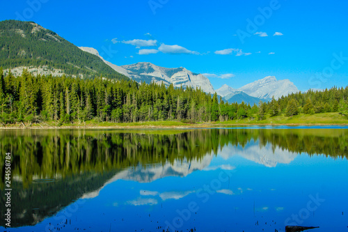 Fototapeta Naklejka Na Ścianę i Meble -  Summer refelcted in Middle Lake, Bow Valley Provincial Park, Alberta, Canada