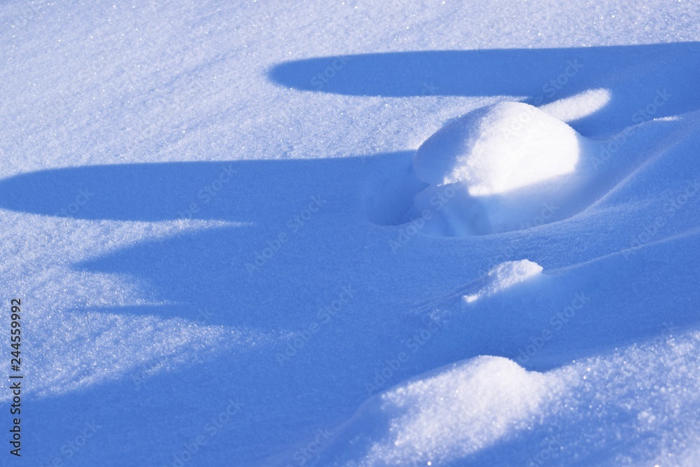 A cold winter day.Drawing on snow.Snowdrift.Abstract background. A cold winter day.Drawing on snow.Snowdrift.Abstract background.