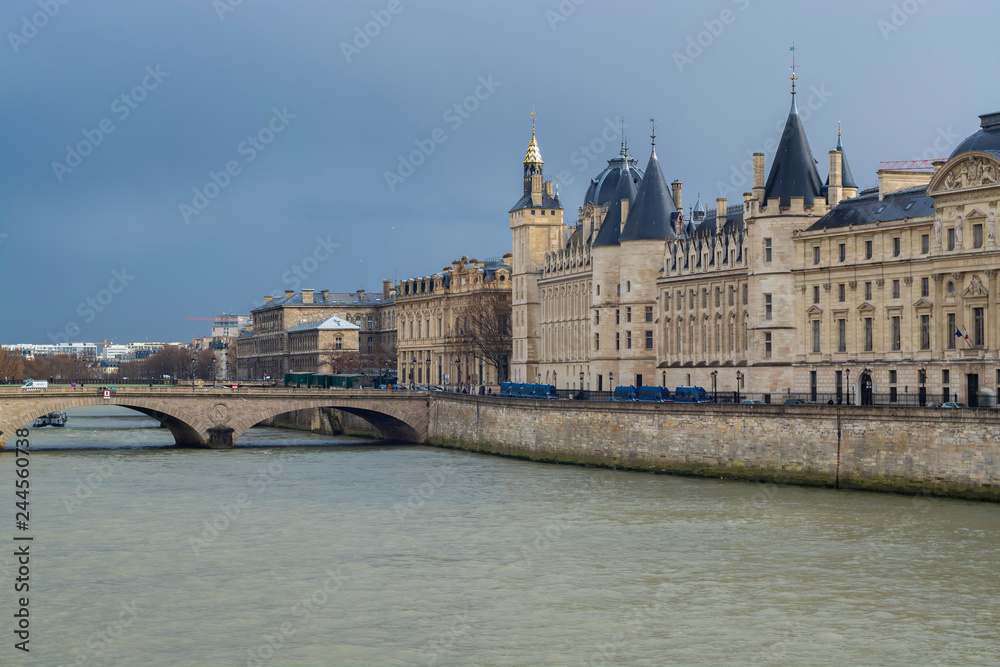 Conciergerie and bridge Change by the Seine river in Paris France. 