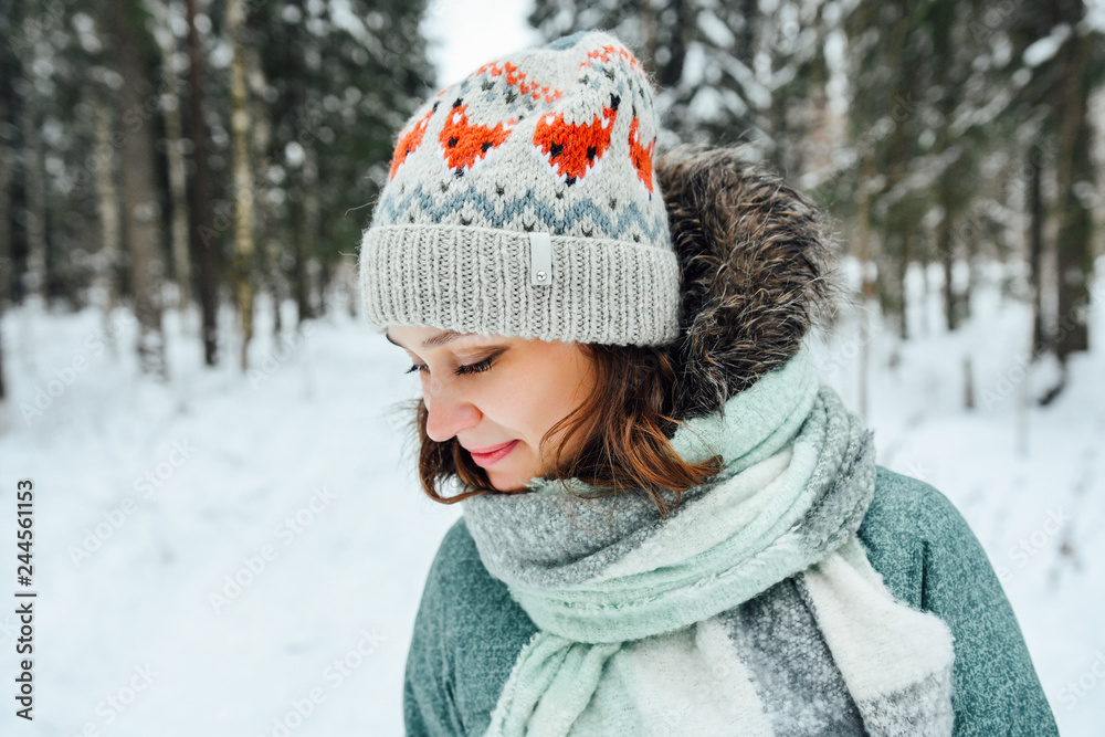 Outdoor close up portrait of young beautiful happy girl, wearing stylish knitted winter hat. Outdoor close up portrait of young beautiful happy girl, wearing stylish knitted winter hat.