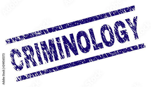 CRIMINOLOGY seal print with distress style. Blue vector rubber print of CRIMINOLOGY caption with retro texture. Text caption is placed between parallel lines.