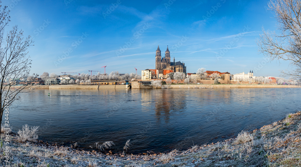 Panoramic view of first frost over amazing sunrise in Magdeburg downtown in Winter, Germany, sunny day, morning
