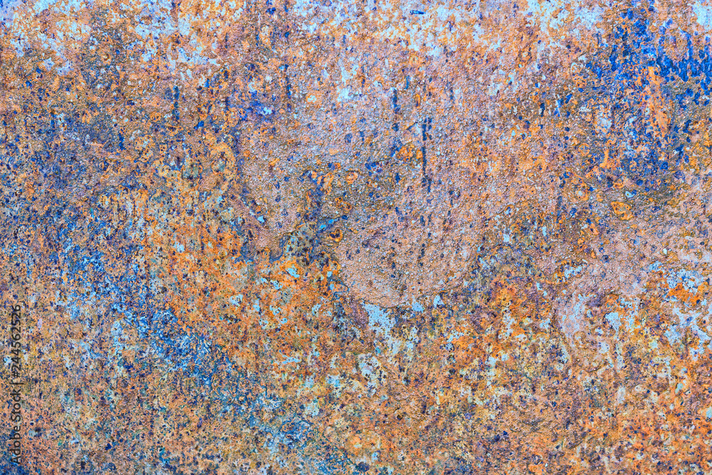 Texture of rusty iron with blue background. The metal surface rusted spots.