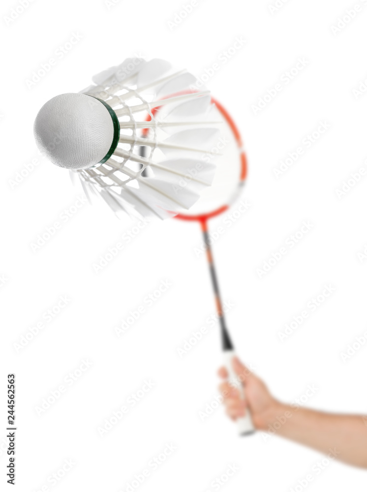 Hand with badminton racket and feather shuttlecock Hand with badminton racket and feather shuttlecock