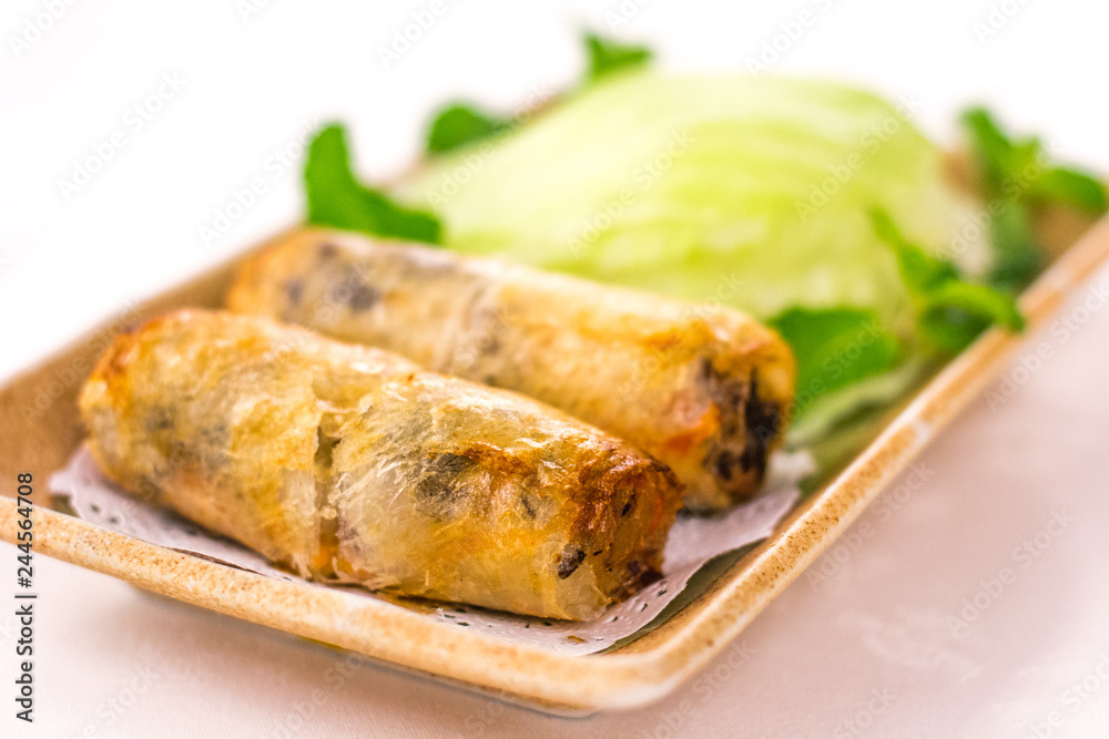 Deep fried Vietnamese Spring Rolls wrapped by fresh lettuce