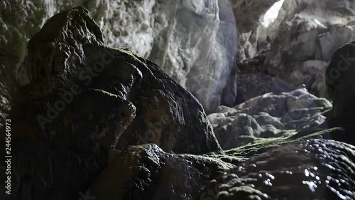 Water Dripping on a Speleothem in The Cave photo