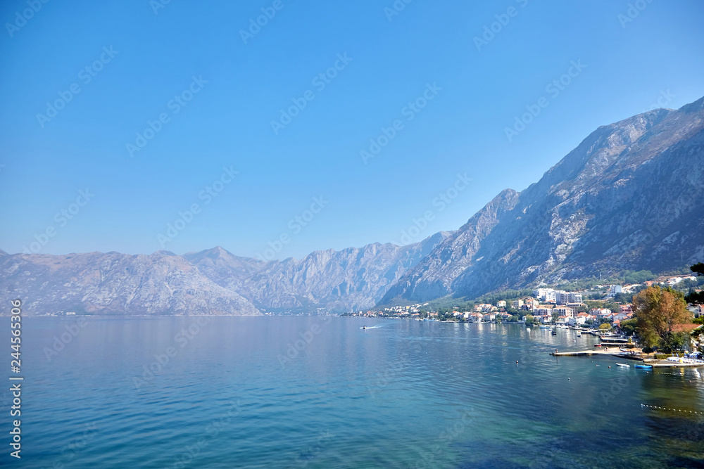 Sea water and mountains, sunny summer day with blue sky, Boka Kotor bay, Montenegro