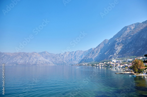 Sea water and mountains, sunny summer day with blue sky, Boka Kotor bay, Montenegro © mikeosphoto