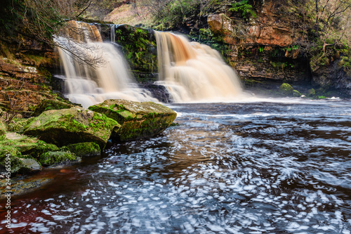 Rocks at Crammel Linn Waterfall  as the River Irthing flows over the 10 metre falls it marks the boundary between Northumberland and Cumbria just north of Gilsland  England
