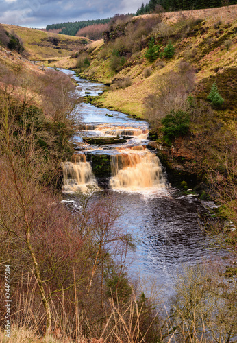 River Irthing Gorge at Crammel Linn Waterfall  as the river flows over the 10 metre falls it marks the boundary between Northumberland and Cumbria just north of Gilsland  England