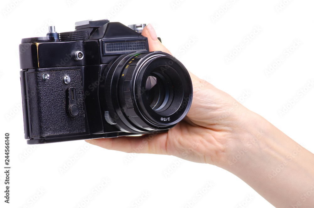 Photo camera old in hands on white background isolation Photo camera old in hands on white background isolation