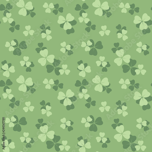 light green seamless pattern with pastel colored shamrock leaves - vector background