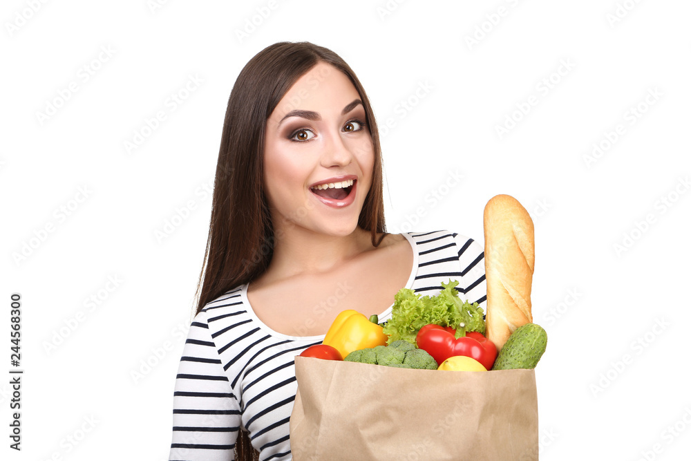 Beautiful woman holding grocery shopping bag on white background Beautiful woman holding grocery shopping bag on white background