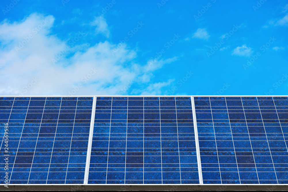 blue solar panels (solar cell) with blue cloud sky background in solar farm. blue solar panels (solar cell) with blue cloud sky background in solar farm.