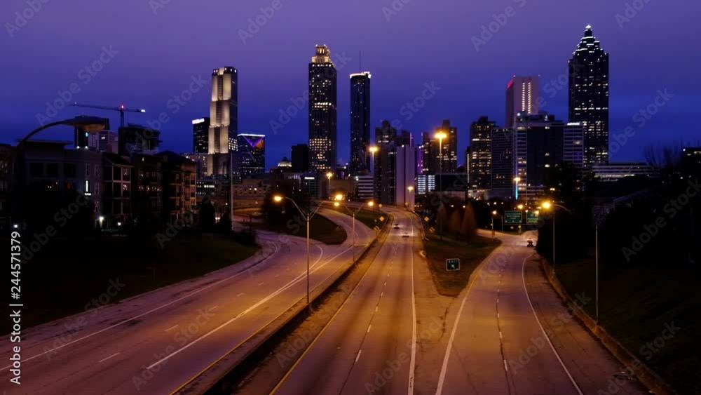 ATLANTA GEORGIA, January 20, 2019: Light car traffic moving towards the Atlanta Georgia downtown modern skyline at night. USA ATLANTA GEORGIA, January 20, 2019: Light car traffic moving towards the Atlanta Georgia downtown modern skyline at night. USA