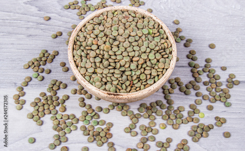 Green lentils - legume seeds with a high content of vegetable protein. Conception of healthy eating.