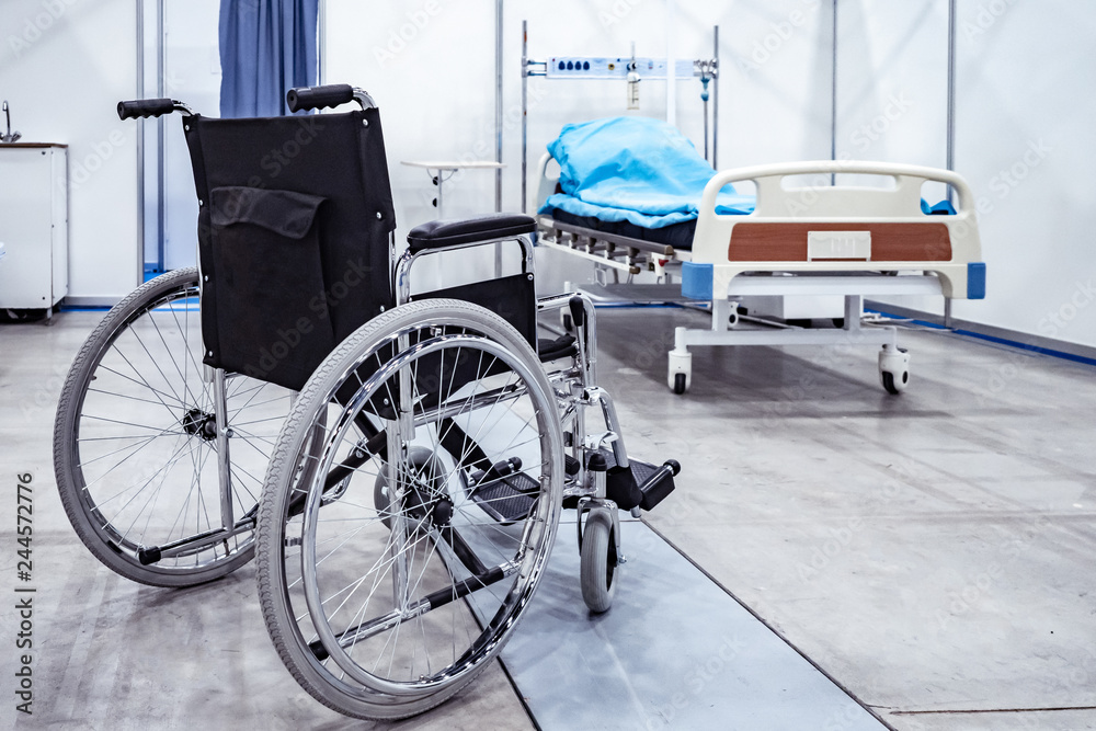 Wheelchair. Medical bed. Disease resulting in disability. Hospital