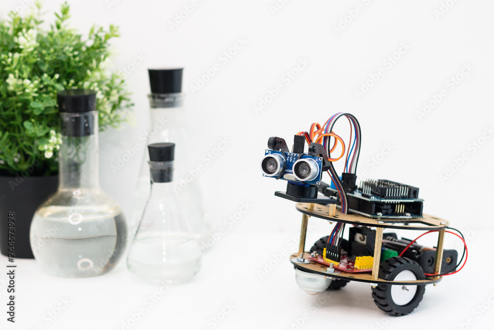 Hand made robot working on the arduino platform. White background. Free ...