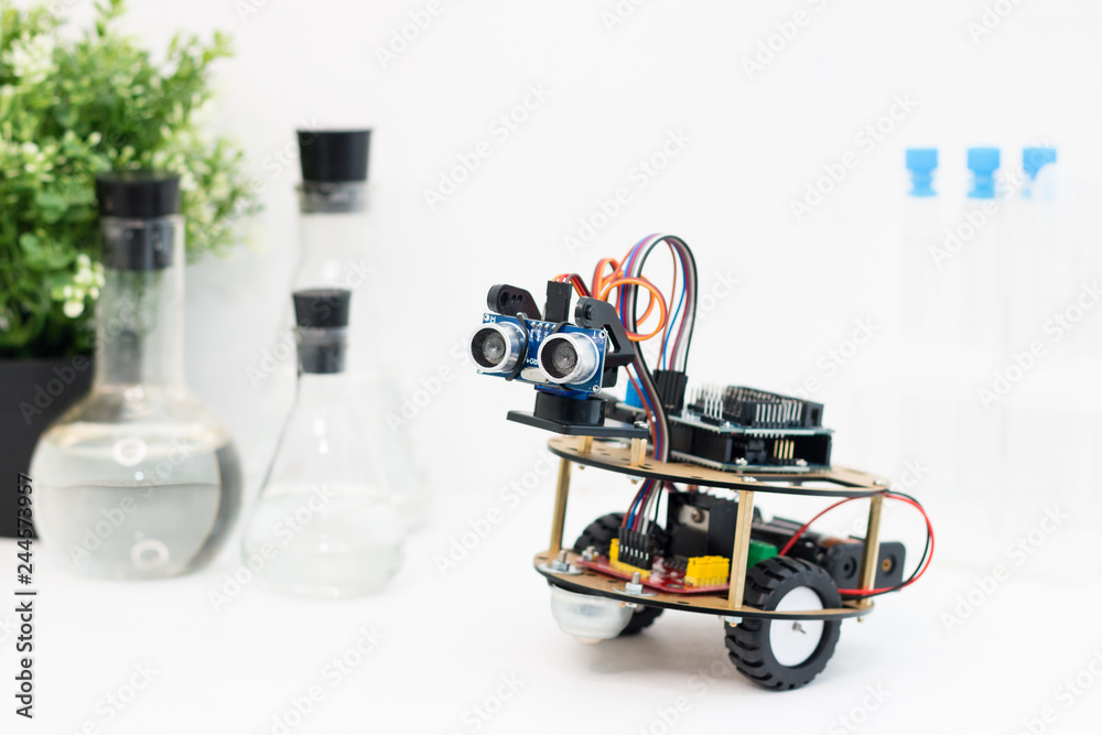 Hand made robot working on the arduino platform. White background. Free ...