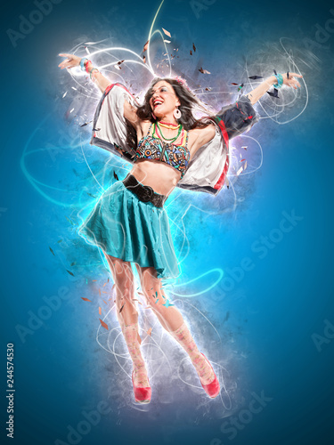 Young sexy dancing woman, with flashes on background, ray of light and neon