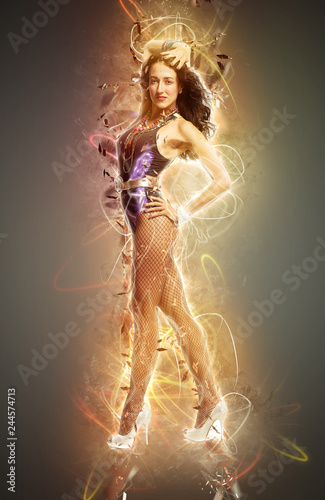 Young sexy dancing woman, with flashes on background, ray of light and neon