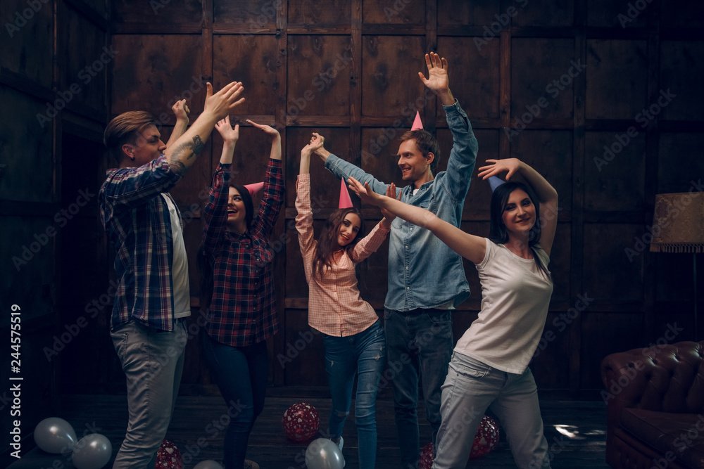 Group of friends dance at birthday party