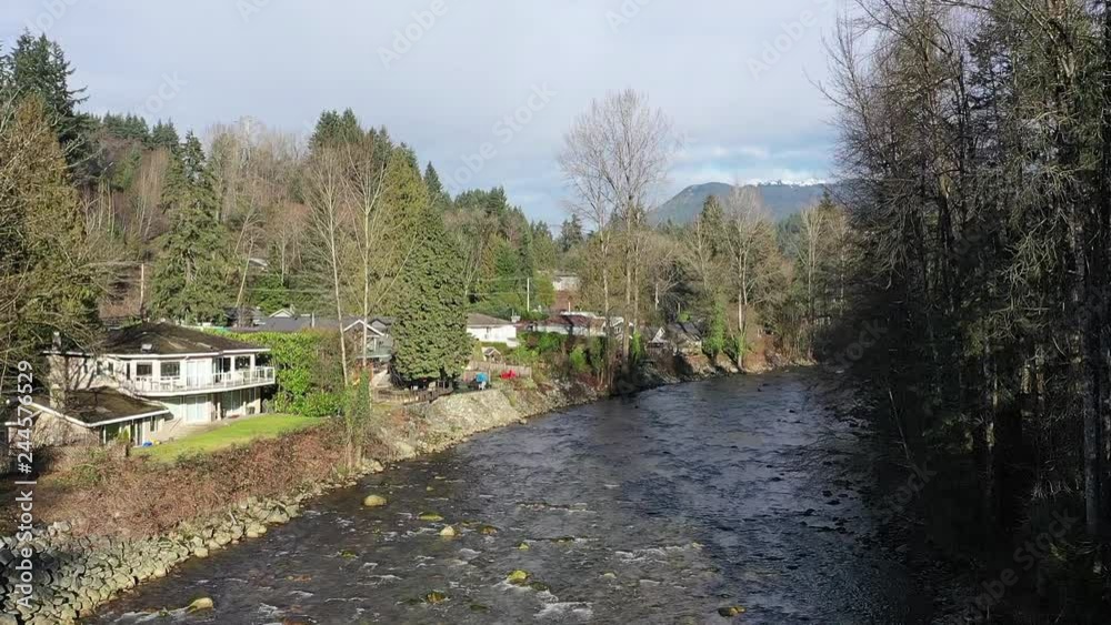 Majestic mountain river in Vancouver, Canada. Drone flying. Aerial view with mountain background. 4K. Majestic mountain river in Vancouver, Canada. Drone flying. Aerial view with mountain background. 4K.