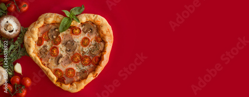 Pizza heart shaped on red