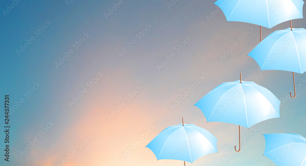 Turquoise umbrella moving in the sky. Card or banner. Weather, meteo