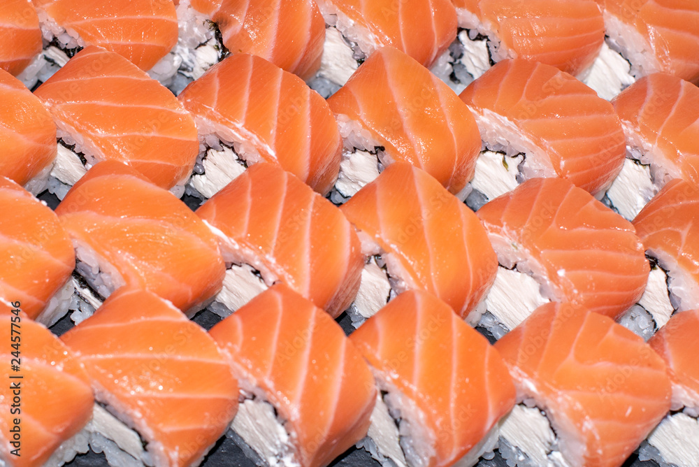Overhead japanese sushi food. Maki ands rolls with tuna, salmon, shrimp, crab and avocado. Top view of assorted sushi, all you can eat menu. Rainbow sushi roll, uramaki, hosomaki and nigiri. Overhead japanese sushi food. Maki ands rolls with tuna, salmon, shrimp, crab and avocado. Top view of assorted sushi, all you can eat menu. Rainbow sushi roll, uramaki, hosomaki and nigiri.