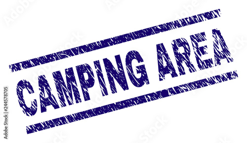 CAMPING AREA seal print with scratced style. Blue vector rubber print of CAMPING AREA title with dust texture. Text label is placed between parallel lines.