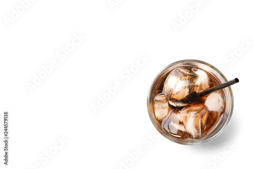 Glass of refreshing cola with ice on white background, top view. Space for text