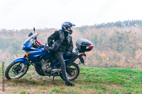 Fototapeta Naklejka Na Ścianę i Meble -  Motorcyclist on off road, enduro, extreme sport, active lifestyle, adventure touring concept, enduro outdoor