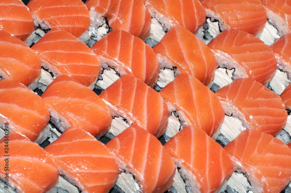 Overhead japanese sushi food. Maki ands rolls with tuna, salmon, shrimp, crab and avocado. Top view of assorted sushi, all you can eat menu. Rainbow sushi roll, uramaki, hosomaki and nigiri. Overhead japanese sushi food. Maki ands rolls with tuna, salmon, shrimp, crab and avocado. Top view of assorted sushi, all you can eat menu. Rainbow sushi roll, uramaki, hosomaki and nigiri.