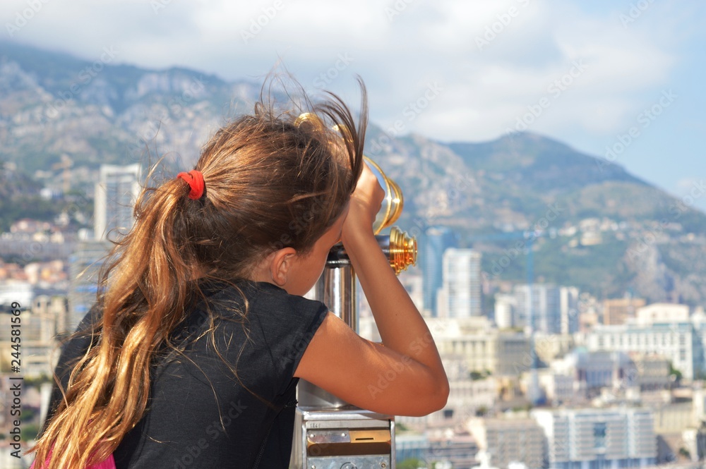 young woman looking through binoculars young woman looking through binoculars