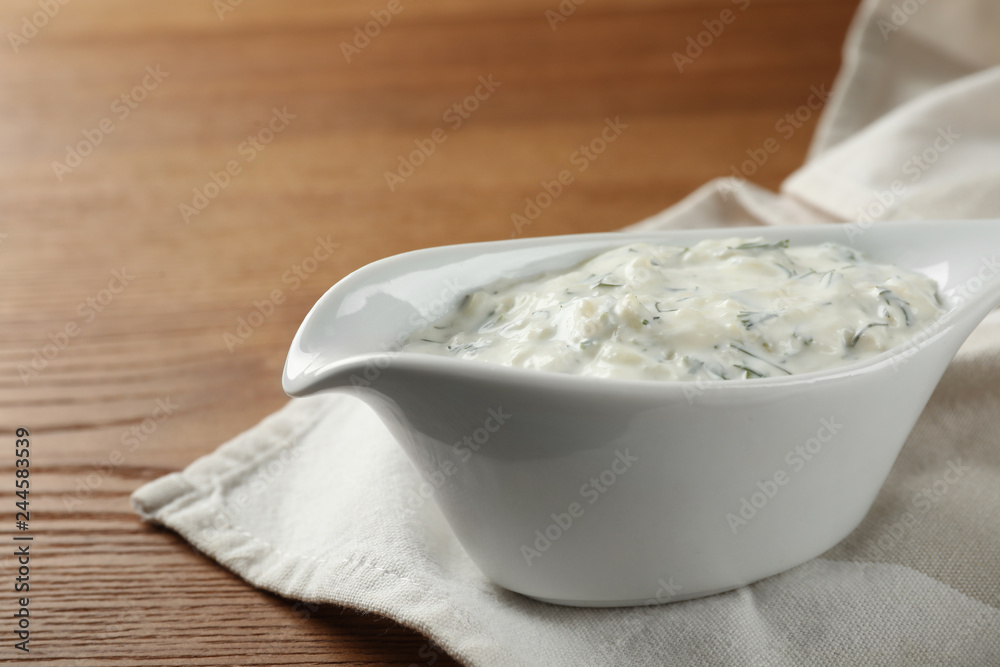 Cucumber sauce on wooden background. Traditional Tzatziki Cucumber sauce on wooden background. Traditional Tzatziki