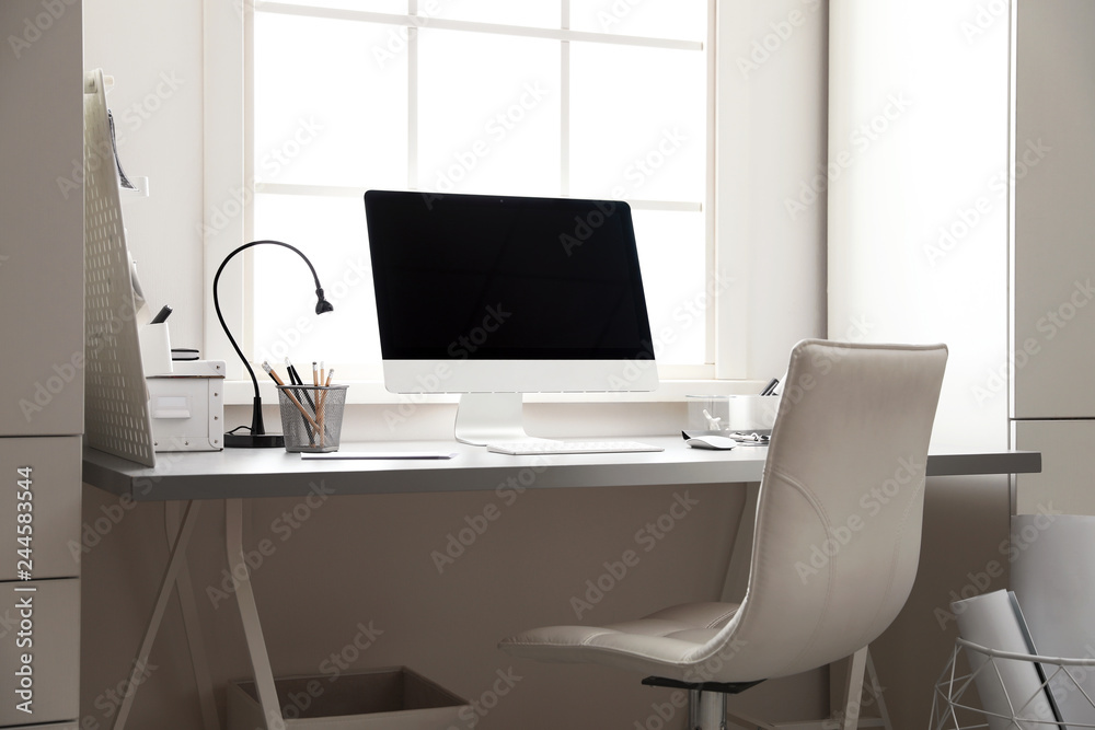 Light work place with computer near window. Interior design Light work place with computer near window. Interior design