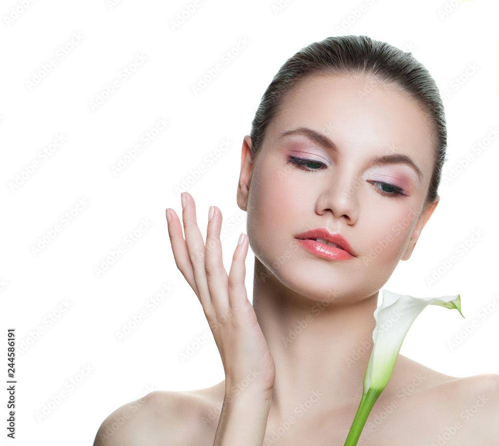 Attractive young woman applying cream on her face. Perfect girl with flower isolated on white background Attractive young woman applying cream on her face. Perfect girl with flower isolated on white background