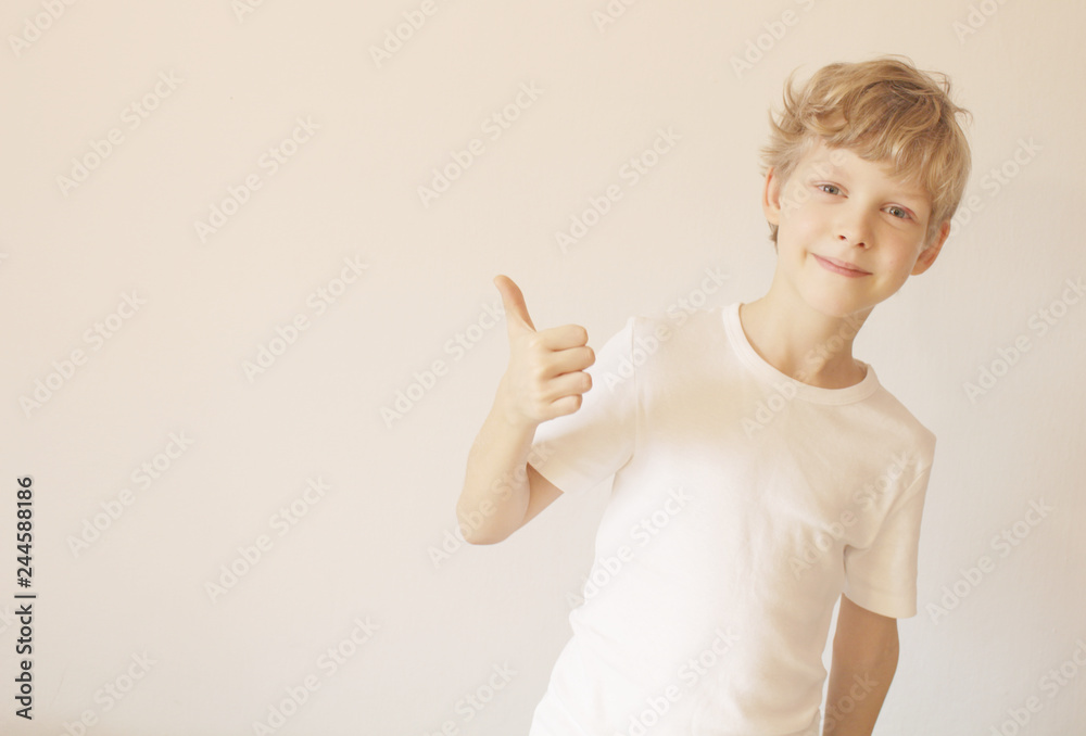 boy showing a thumbs up boy showing a thumbs up