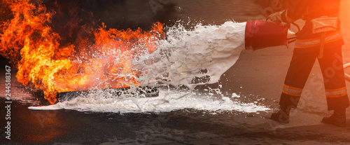  firefighter extinguishes the fire with smoke.